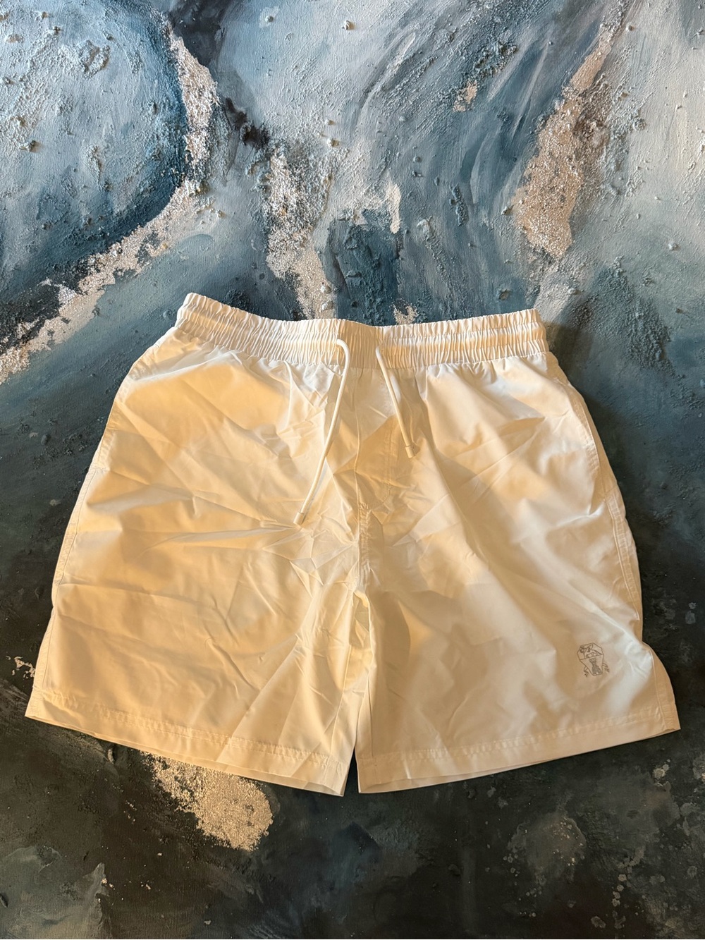 Brunello Cucinelli White Drawstring Swim Shorts.

Like new , comes with a bag.